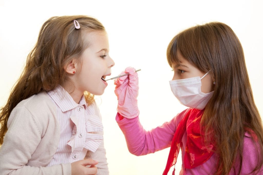 little girls playing dentist