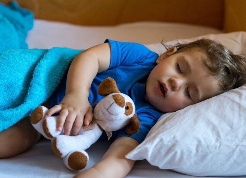 young boy sleeping with his mouth open