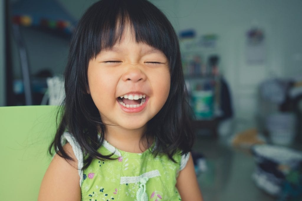 young girl laughing